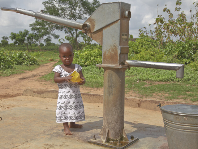 Girl at water pump East Gonja