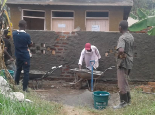 KAHASA working on curtain wall of latrines at a health centre (IRC Uganda)