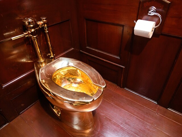 Golden toilet (photo by Leon Neal/Getty Images)