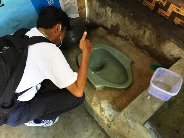 Indonesia SEHATI project, taking picture of toilet. SNV