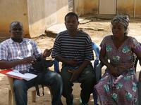 Emmanuel Kobla Kpevor, WSMT Secretary (middle) and Elizabeth Setudor, water vender (right), talking to IRC Ghana DCO- Victor Narteh Otum (far left)