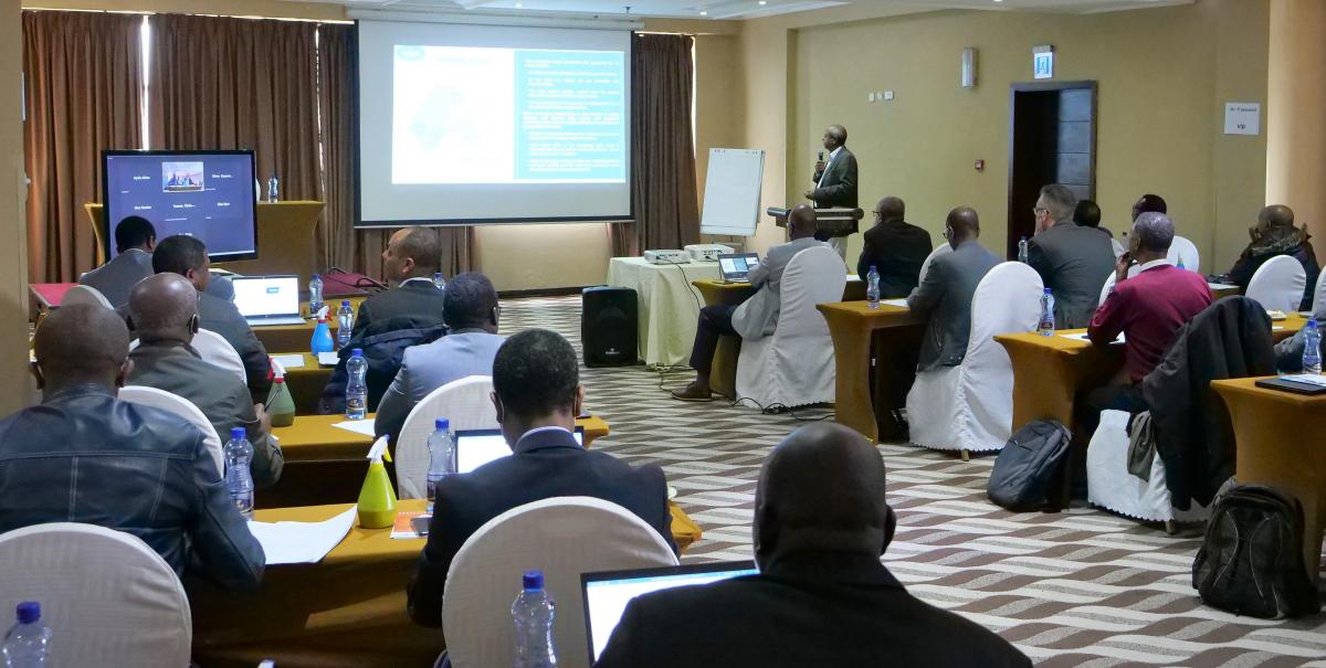 Mr. Abyi Girma, the One WASH National Coordination Office Coordinator, presenting about the policy, strategy, and plan for CR WASH in the lowlands of Ethiopia.
